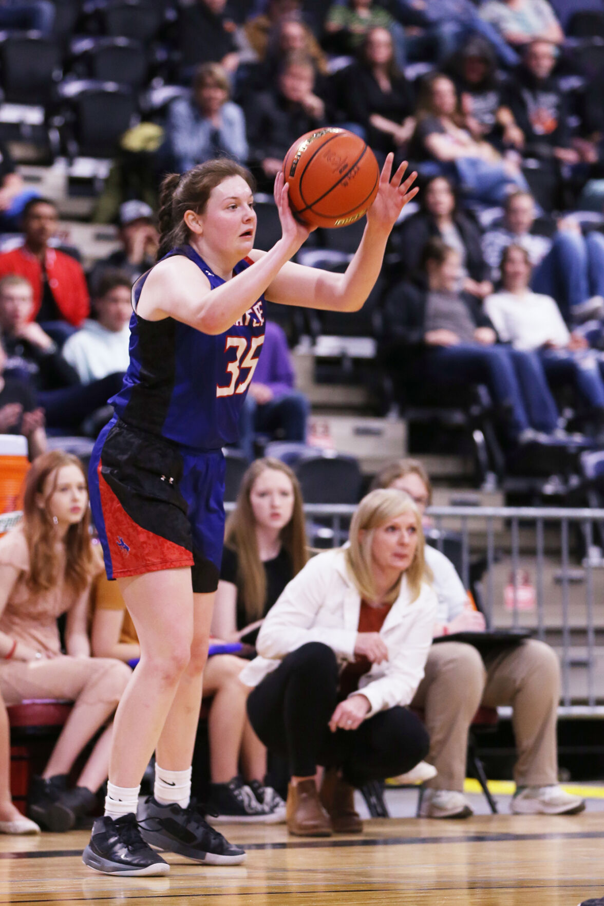 Kaycee High School freshman Cheyenne Elwood steps into a pass